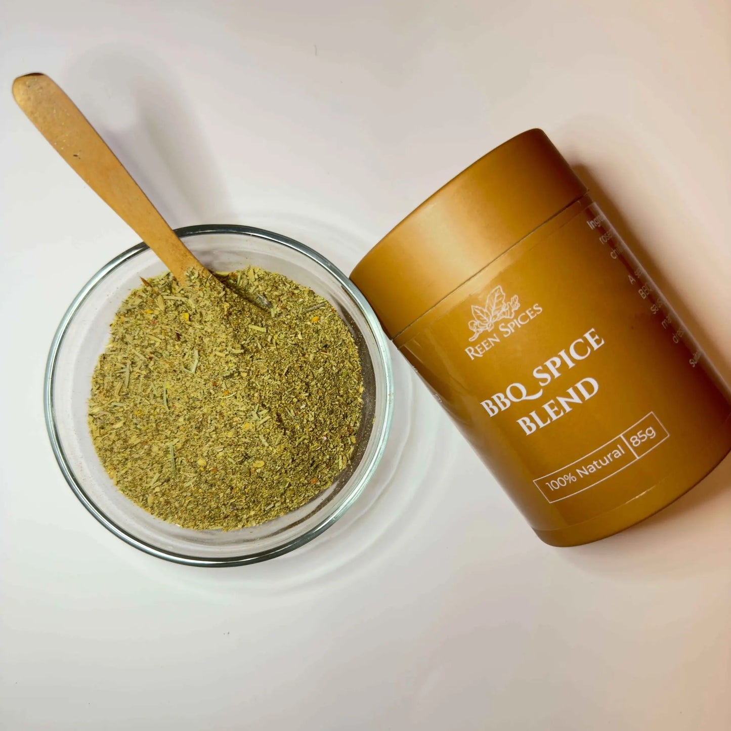 bbq spice in a bowl and a spice container lying on the side